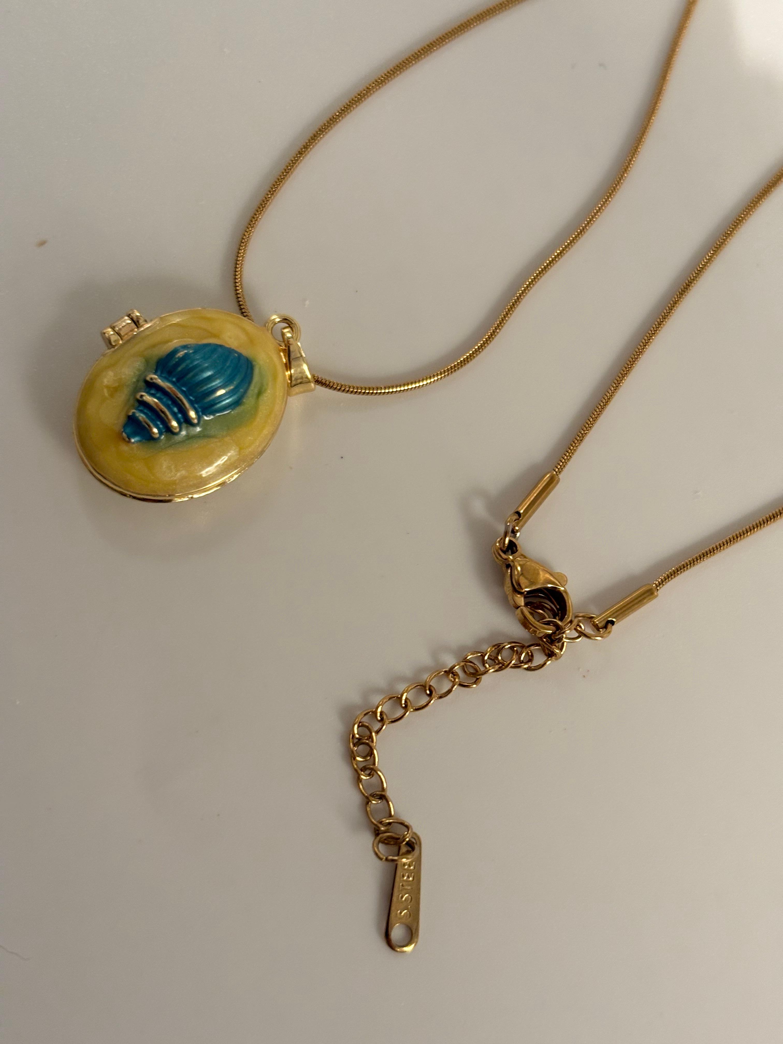 Yellow shell locket necklace